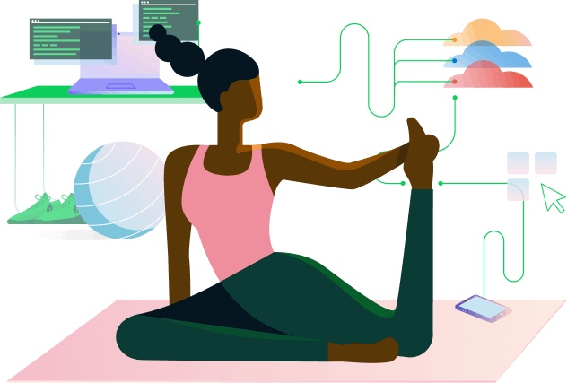 A woman on the floor stretching her leg in a yoga pose with a computer in the background