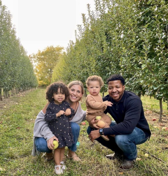 Photo of Daniel, his wife, and daughters.